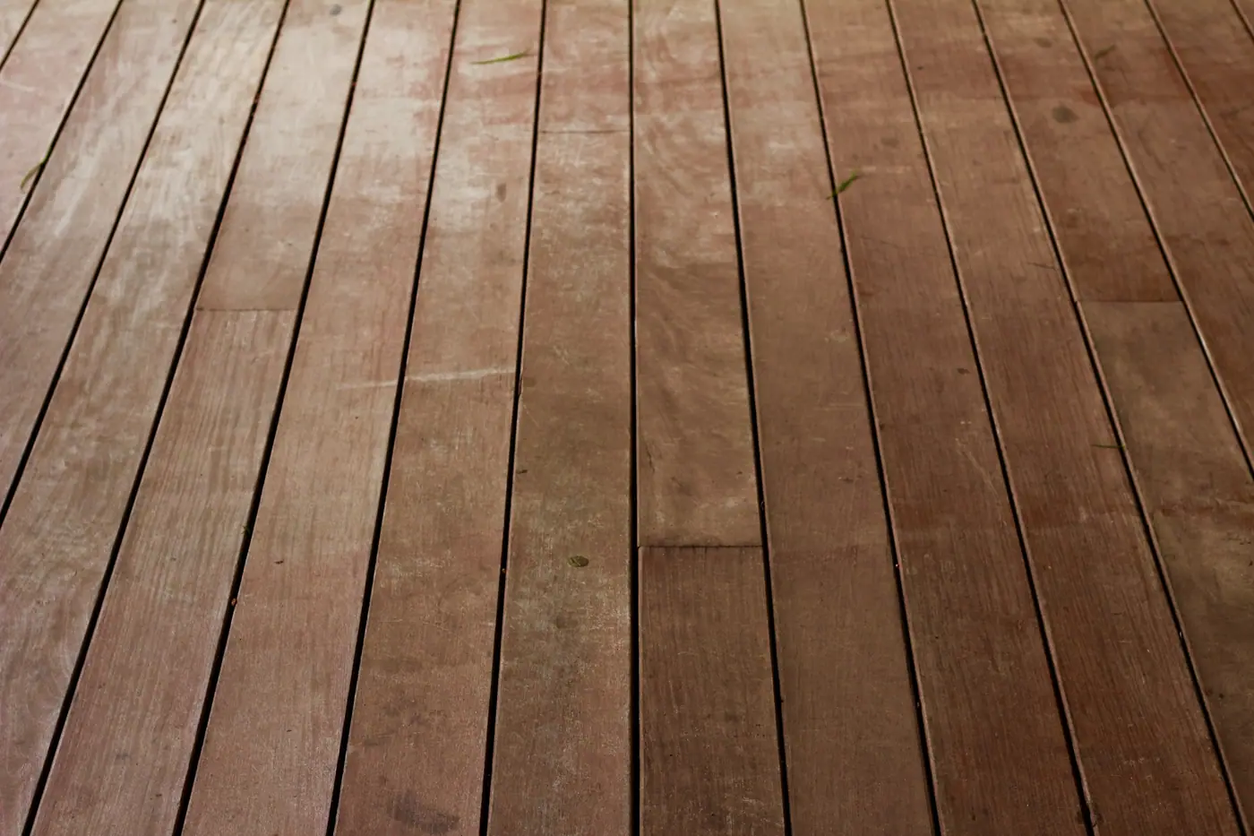 After: new, evenly spaced cedar-toned deck boards